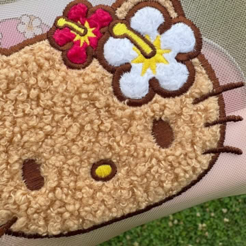 日焼け ハローキティ　メッシュポーチ
